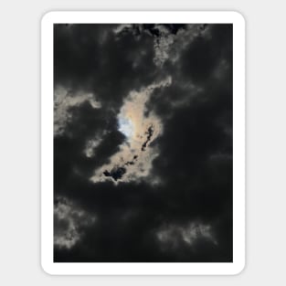 Light of hope. Horror sky. Thick grey clouds-cape with bright sun peeping out through the clouds Sticker